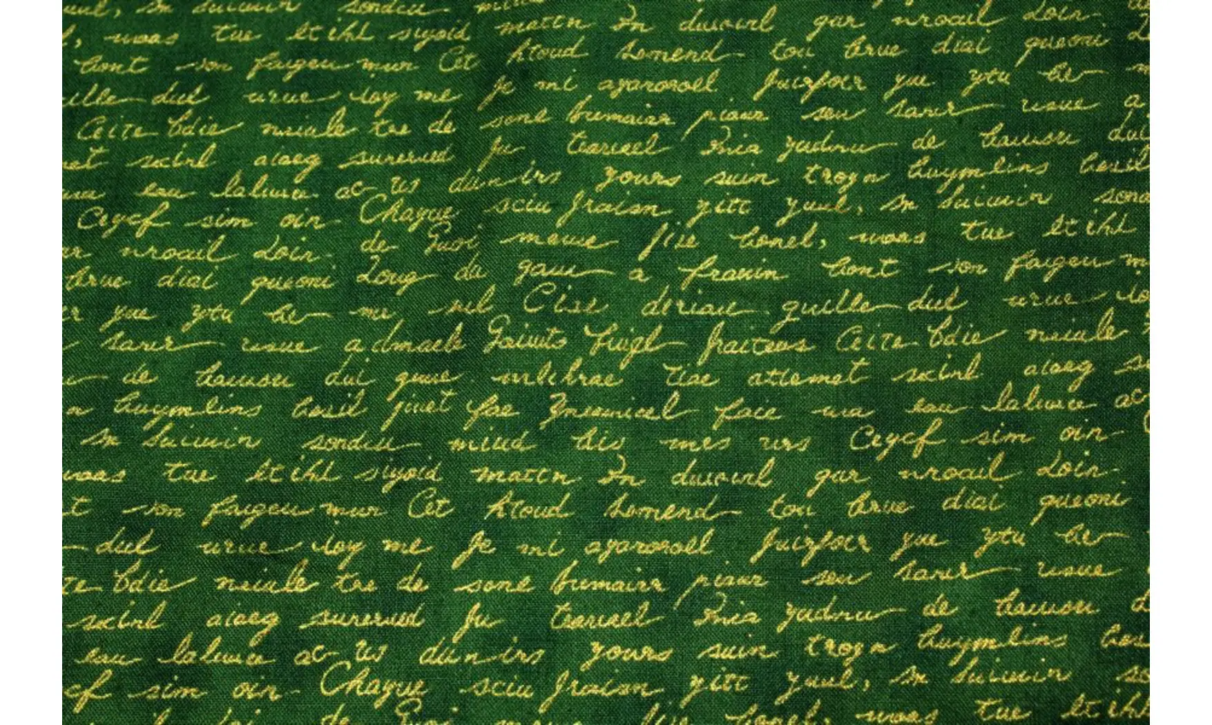 Tissu vert écritures dorées
