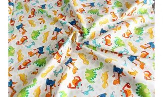 Tissu dinosaures en fête