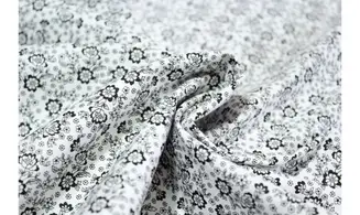 Tissu blanc petites fleurs noires