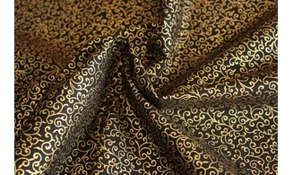Tissu noir volutes dorées