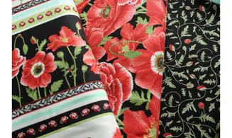 Tissu noir boutons coquelicots