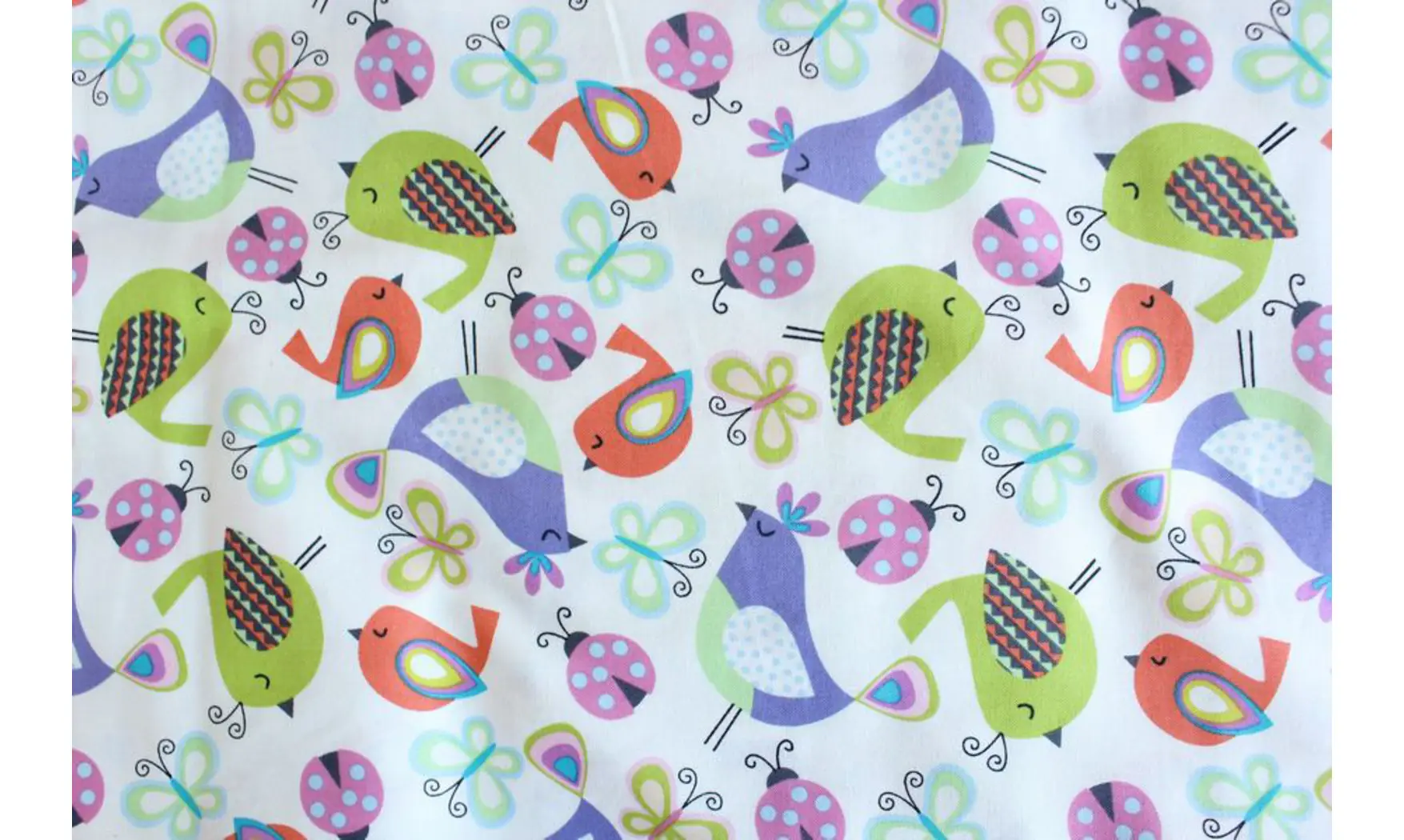 Tissu oiseaux coccinelles papillons